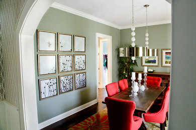 Photo of a mid-sized modern separate dining room in Orlando with green walls, dark hardwood floors and no fireplace.