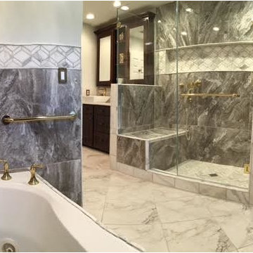 Master Bath w/ custom Mahogany cabinets, large porcelain tiles and marble tiles