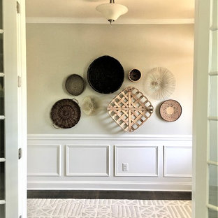 Example of a mid-sized eclectic dark wood floor and brown floor entryway design in Charlotte with gray walls and a white front door