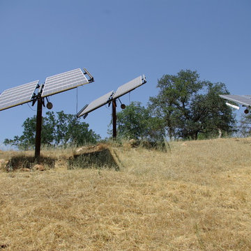 Rammed Earth Off-Grid Country Home: Tracking solar collectors