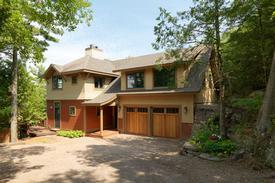 Rustic two-story wood exterior home idea in Burlington