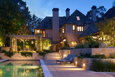 Inspiration for a large timeless brown two-story stucco exterior home remodel in San Francisco