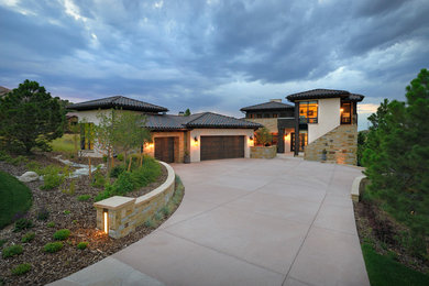 Large modern beige one-story mixed siding exterior home idea in Denver