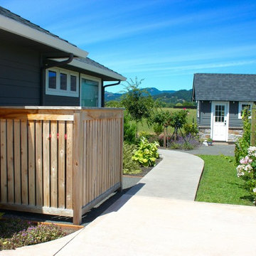 Project #3 AFTER: Utility bin screen, wine grapes, and garden shed