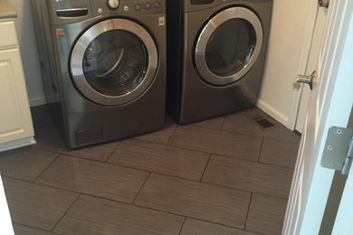 Minimalist laundry room photo in Denver