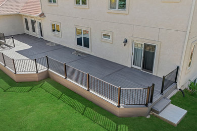 Example of a large metal railing deck design in Denver