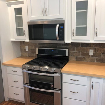 New Construction Milan, IL Koch Express Painted White Formica Amber Maple