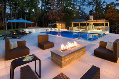 Example of a large trendy tile and rectangular pool house design in Atlanta