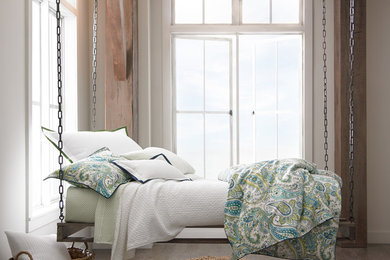 Inspiration for a large coastal master dark wood floor bedroom remodel in Other with beige walls
