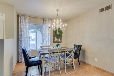 Inspiration for a mid-sized cottage dining room remodel in Phoenix