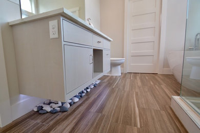 Bathroom - mid-sized contemporary master multicolored tile and ceramic tile ceramic tile bathroom idea in Other with flat-panel cabinets, gray cabinets, a two-piece toilet, white walls, an undermount sink and quartz countertops