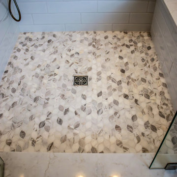 Luxury Spa Bathroom with Natural Warm Vanities, Quartz Countertop, Tiled Shower