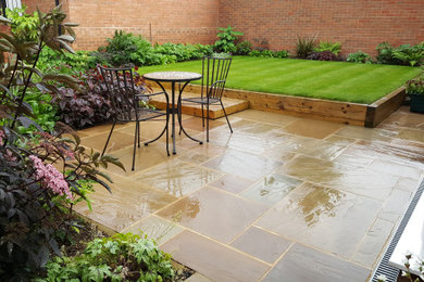 Inspiration for a small contemporary back garden for summer in Oxfordshire with natural stone paving.