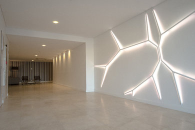 Inspiration for an expansive contemporary open concept living room in Perth with white walls, marble floors and no tv.