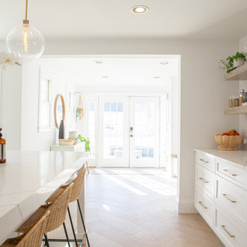 All White Transitional Kitchen with Herringbone Wood Floor