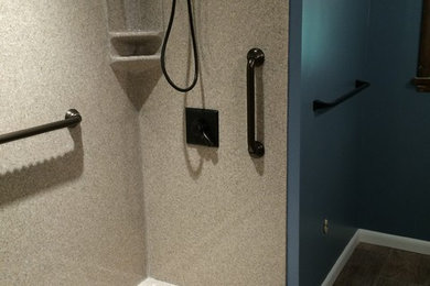 Mid-sized elegant master beige tile and stone slab medium tone wood floor and brown floor bathroom photo in St Louis with shaker cabinets, white cabinets, a two-piece toilet, green walls, an integrated sink and granite countertops