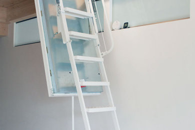 This is an example of a scandi metal straight staircase in Other with metal risers and under stair storage.