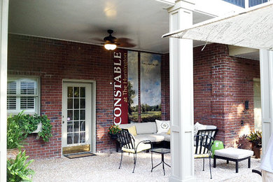 Patio - small traditional courtyard concrete patio idea in Atlanta with a roof extension