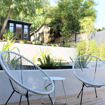 Acapulco Chairs on Deck in Front of Backyard She Shed