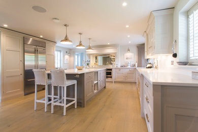 This is an example of a mid-sized country kitchen in London.