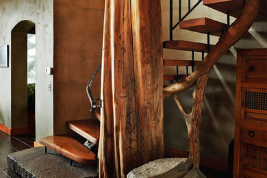 Inspiration for a mid-sized country wood curved staircase in Portland with open risers.