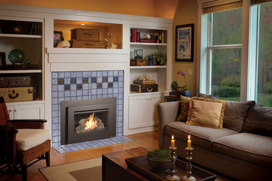 Inspiration for a mid-sized eclectic enclosed bamboo floor and beige floor living room remodel in Seattle with yellow walls, a standard fireplace and a tile fireplace