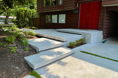 Photo of a mid-sized modern partial sun front yard driveway in Vancouver.