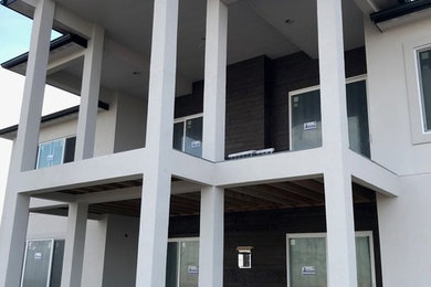 Industrial exterior home idea in Other