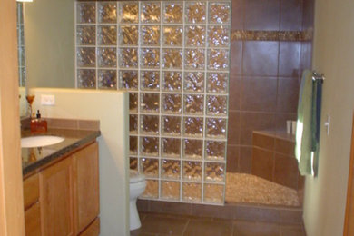 Mid-sized master beige tile and ceramic tile ceramic tile alcove shower photo in Portland with a drop-in sink, medium tone wood cabinets, solid surface countertops and green walls