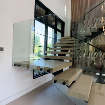 Glass Balustrade and Black-Framed Glazing at the Stair - Woodland Hills