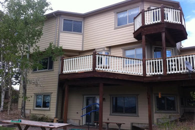 Inspiration for a large rustic backyard deck remodel in Denver with no cover