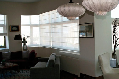 This is an example of a small asian formal open concept living room in New York with beige walls, dark hardwood floors, no fireplace, no tv and brown floor.