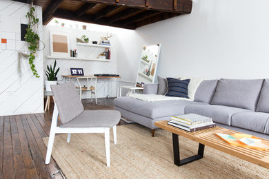Inspiration for a scandinavian open concept dark wood floor living room remodel in Chicago with white walls and no fireplace