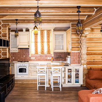 Кухня-гостиная в деревянном доме из оцилиндрованного бревна