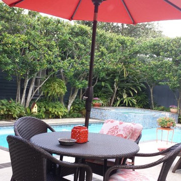Pool, waterfall, and landscaping