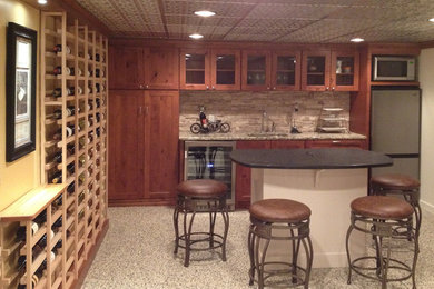 Example of a mid-sized arts and crafts wine cellar design in Cleveland