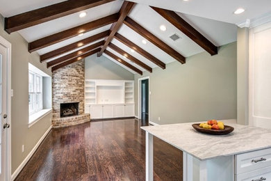 Inspiration for a mid-sized transitional open concept dark wood floor family room remodel in Houston with gray walls, a corner fireplace and a stone fireplace