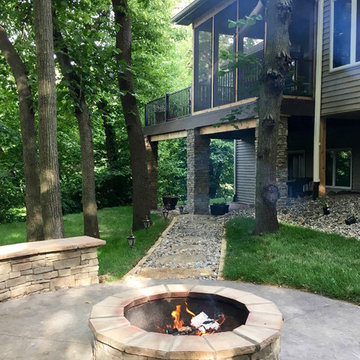 Stamped Concrete Patio with Veneer Stone Fire Pit & Seat Wall
