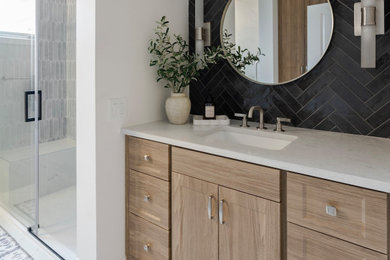 Example of a mid-sized trendy master black tile single-sink bathroom design in Other with shaker cabinets, medium tone wood cabinets, quartz countertops, white countertops and a built-in vanity
