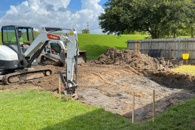 Photo of a mid-sized partial sun hillside pond in New Orleans.