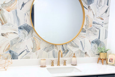 Example of a white tile powder room design in Los Angeles with raised-panel cabinets, blue cabinets, quartz countertops, white countertops, a built-in vanity and an undermount sink