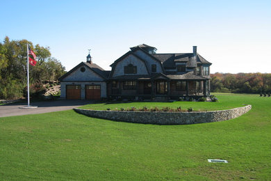 Inspiration for a large traditional partial sun front yard landscaping in Providence.
