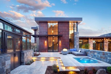 Example of a trendy mixed siding exterior home design in Other