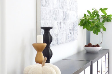 Example of a large transitional medium tone wood floor and brown floor dining room design in Toronto with white walls and a standard fireplace