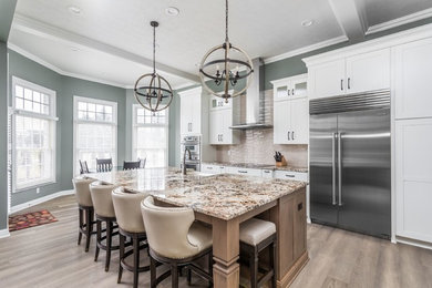 Open concept kitchen - large transitional medium tone wood floor open concept kitchen idea in Indianapolis with a farmhouse sink, granite countertops and an island