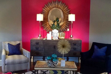 Example of an eclectic formal living room design in Other with pink walls