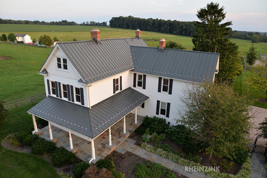 Inspiration for a country white exterior home remodel in Boston