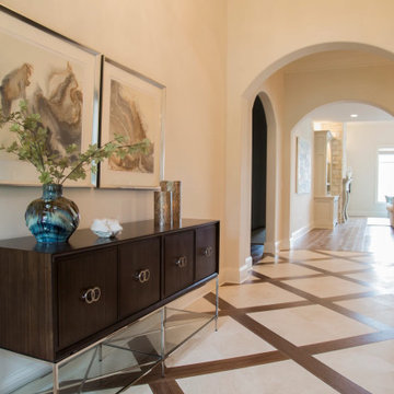 Tile and wood patterned floors make the entry extra special.