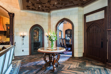 Mid-sized elegant dark wood floor entryway photo in Austin with white walls and a dark wood front door