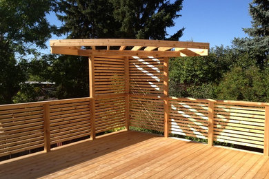 Deck - large coastal rooftop deck idea in Calgary with no cover
